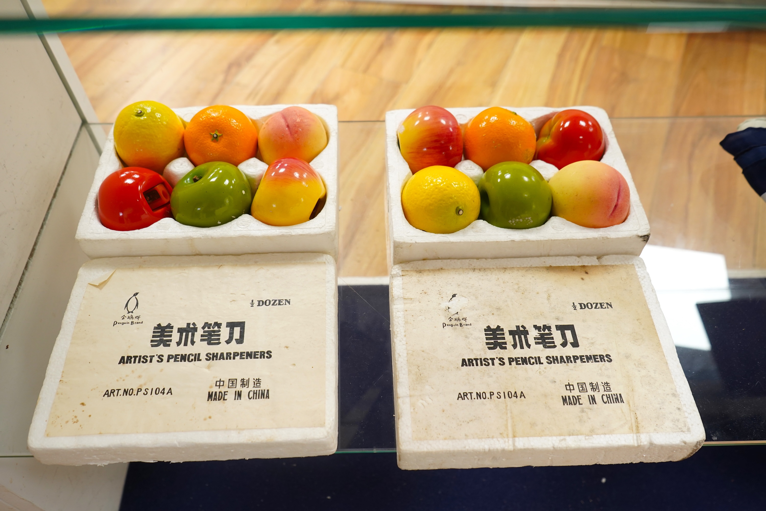 Two boxed sets of novelty Chinese Penguin Brand pencil sharpeners in the form of fruit